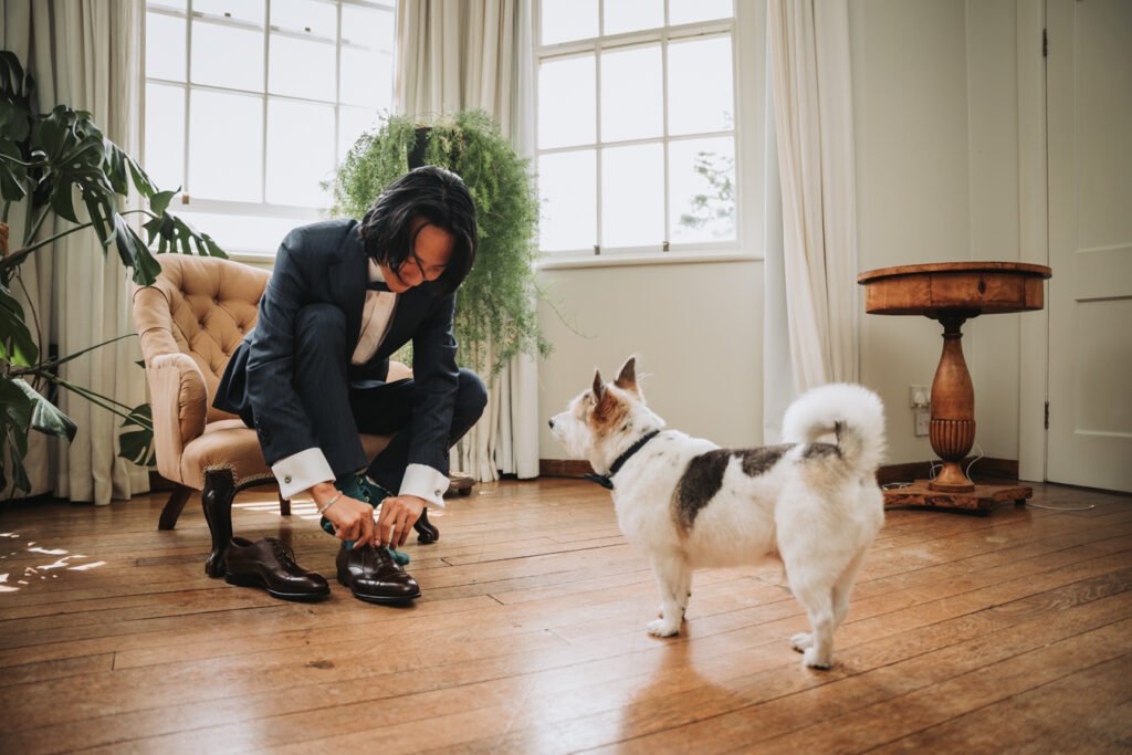 The Lost Music Hall Devon groom getting ready wedding with dog