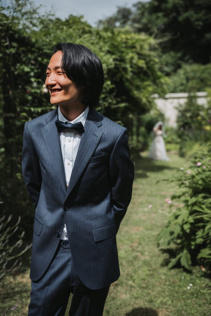 First look in the hidden garden maze by Lost Music Hall destination wedding photographer.