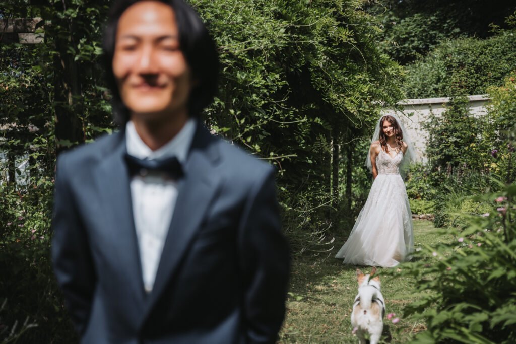 First look in the hidden garden maze by Lost Music Hall destination wedding photographer.