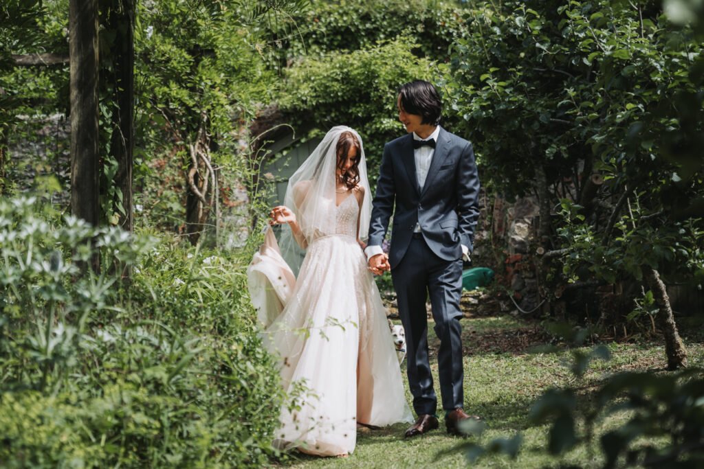 First look in the hidden garden maze by Lost Music Hall destination wedding photographer.