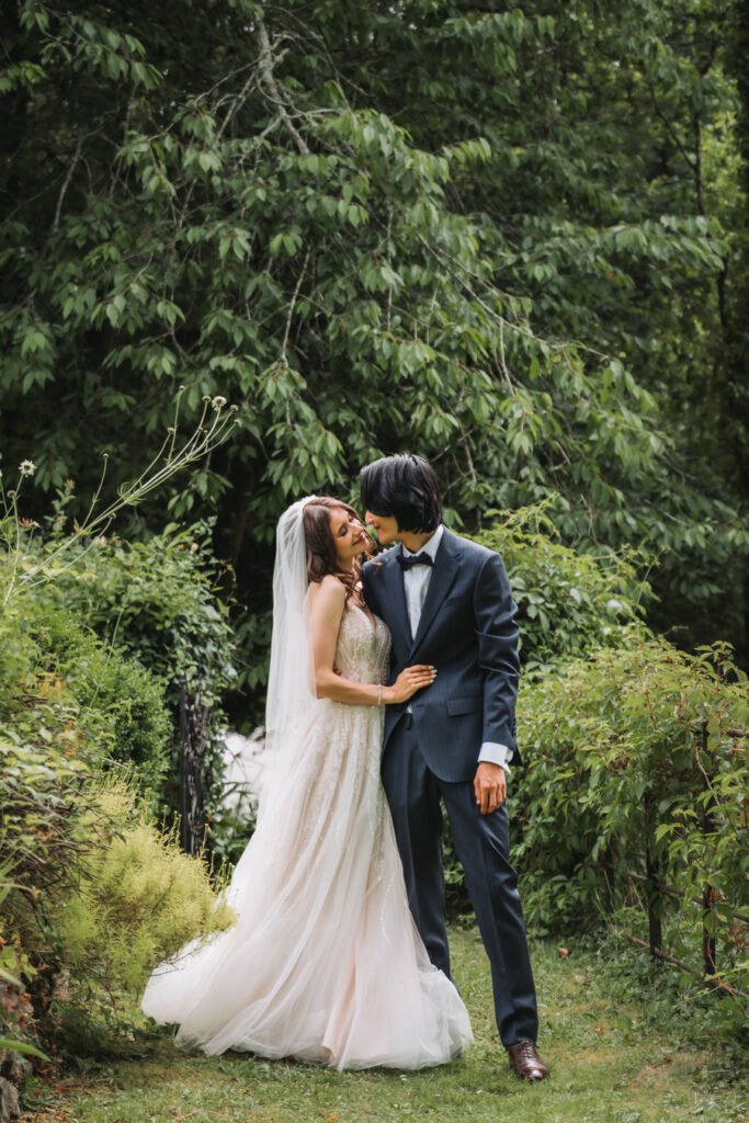 First look in the hidden garden maze by Lost Music Hall destination wedding photographer.