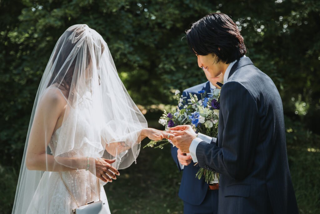 Outdoor wedding ceremony in South Devon field at Lost Music Hall.
