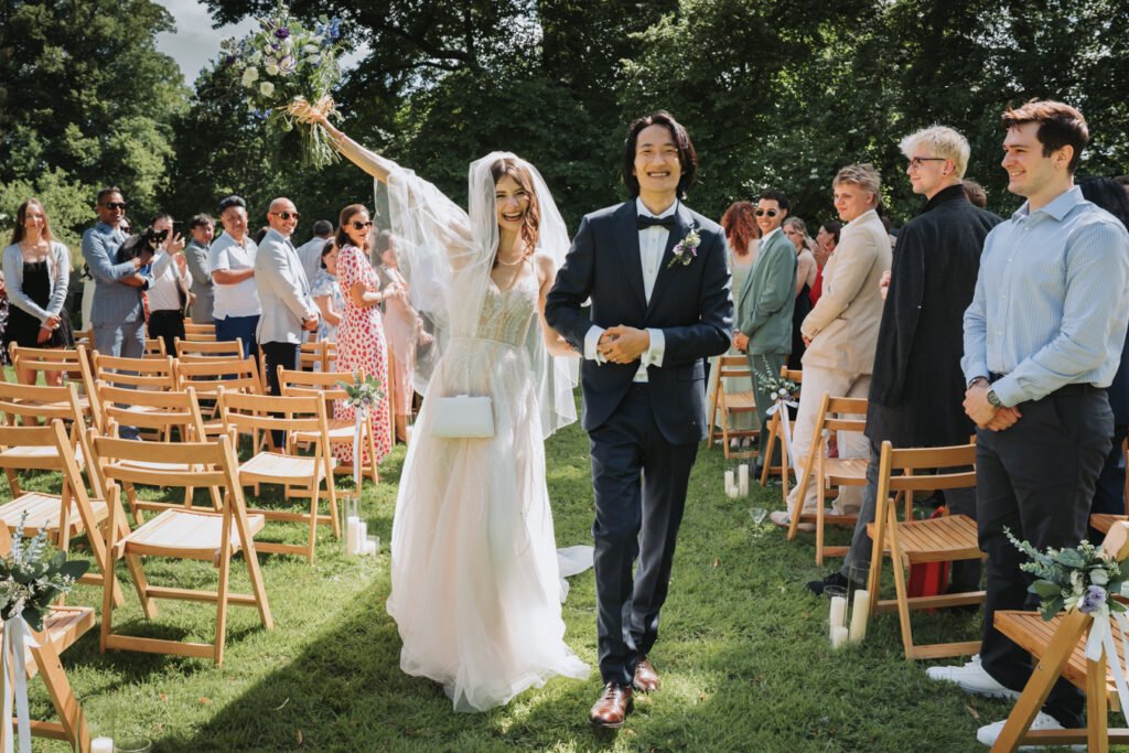Outdoor wedding ceremony in South Devon field at Lost Music Hall.